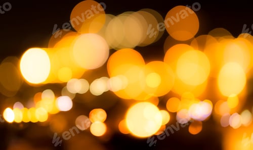 Preview: Blurred yellow bokeh background. Blur abstract background of urban light. Warm light with beautiful