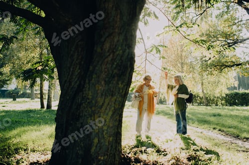 Preview: Senior women enjoying autumn colors in park