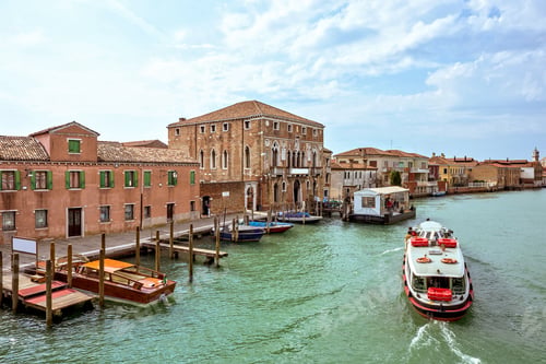 Preview: Daylight view to Venetian Lagoon canal with parked boats