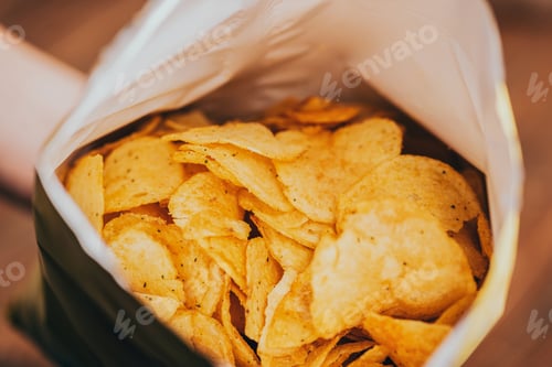 Preview: close up view of delicious crispy potato chips in package