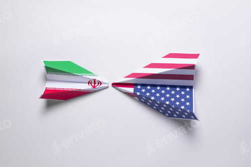 Preview: Flags of USA and Iran painted on two two paper plane.