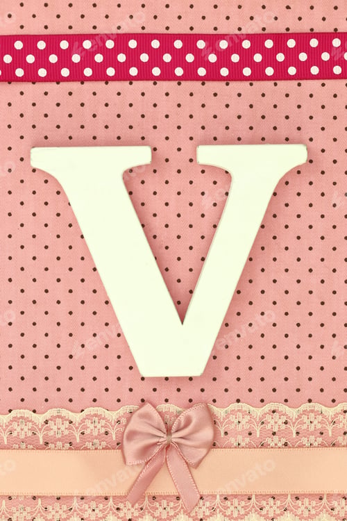 Preview: Wooden letter V on polka dots background