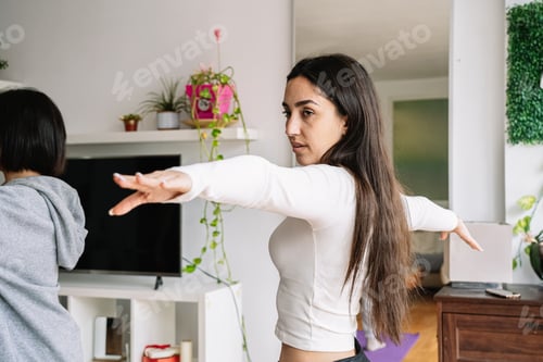 Preview: Woman Practicing Yoga at Home