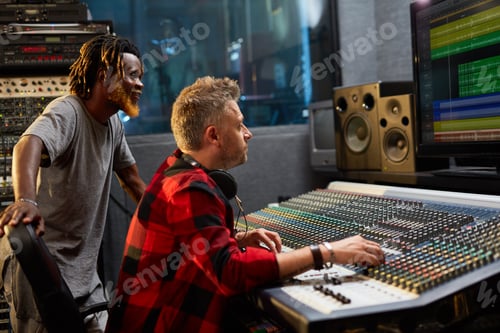 Preview: Sound Engineers Work Together in Recording Studio