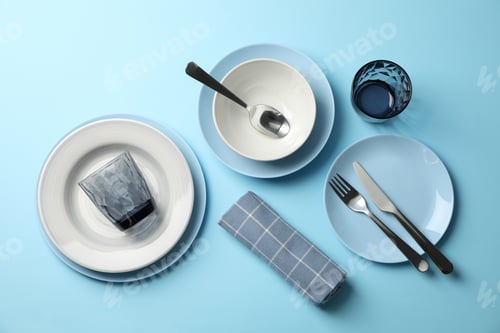 Preview: Stylish table setting on blue background, top view