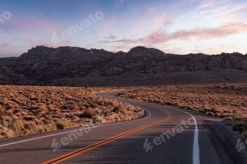 Preview: Scenic highway in the mountain landscape. Sunset Sky.