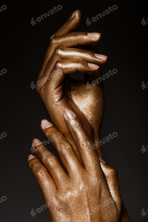 Preview: beautiful hands in golden paint