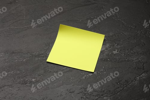 Preview: Blank yellow sticky note on a black surface