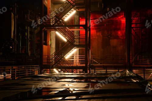 Preview: Red illuminated metal staircase at night on the site of the Zollverein colliery in Essen, Germany