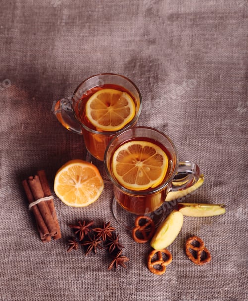 Preview: two glasses of mulled wine on the old wooden table in winter frosty day