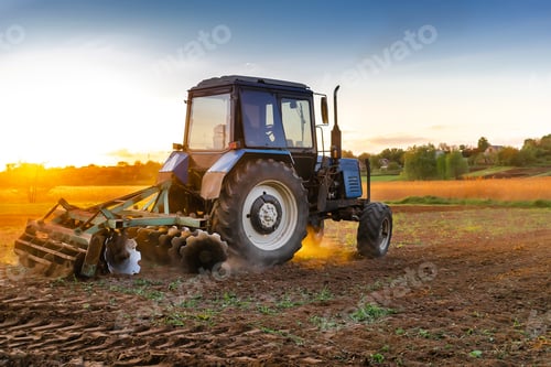 Preview: blue tractor machinery plowing agricultural field cultivating,soil tillage seeding plants,crops