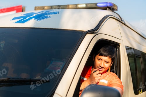 Preview: Portrait of paramedic team in ambulance use walkie talkie is assist an injured in an emergency