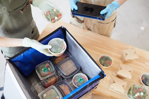 Preview: People packing food into the bag