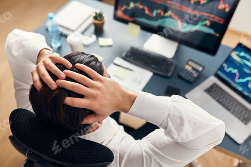 Preview: Worried businessman looking at charts stressed by news from stock market. Investor lost money online