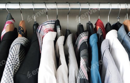 Preview: Mans clothing hanging in the closet.