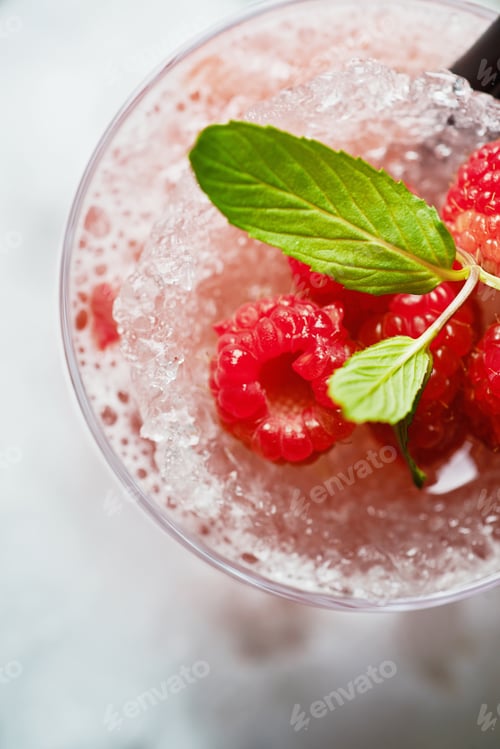 Preview: bright beautiful bright glass of alcoholic cocktail or lemonade on a table in a bar. soft focus.