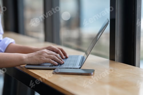 Preview: Asian businesswoman working on laptop Online document database, analyzing financial reports Data rec