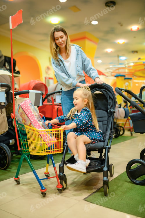 Preview: Mother and girl in baby stroller, toy's store