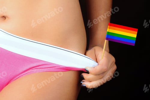 Preview: Sexy woman holding underwear and mini lgbt rainbow flag