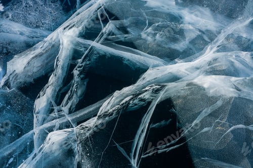 Preview: Close up View of Cracks of Frozen Water in Winter