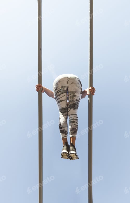 Preview: Woman training on parallel bars