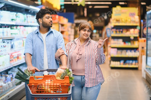 Preview: Indian couple shopping for groceries in supermarket together