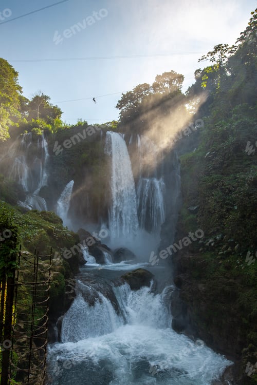 Preview: Sunrise inside the Pulhapanzak waterfall on Lake Yojoa, vertical photo. Honduras