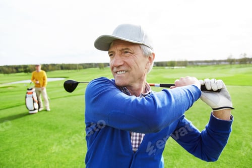 Preview: Senior Man Playing Golf on Green Countryside