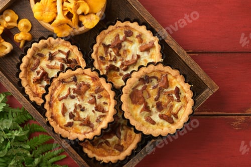 Preview: Savory hands pie with chanterelle mushrooms, cream and cheese on cutting board on rustic old red woo