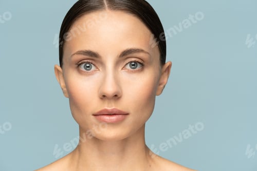 Preview: woman face with perfect fresh clean skin without make up and wrinkles, looking at camera