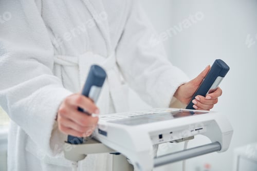 Preview: Woman is monitoring her individual progress after physical exercise