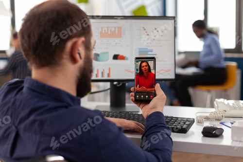 Preview: Paralyzed businessman discussing management strategy with remote collegue