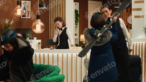 Preview: Asian tourist talking to receptionist