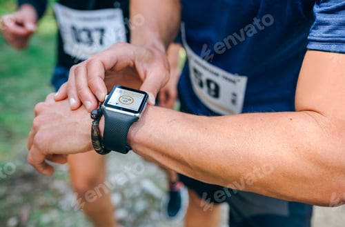 Preview: Sportsman looking a smartwatch