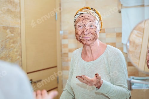 Preview: Senior woman taking care of her face