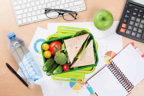 Preview: Office desk with supplies and lunch box