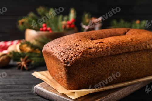 Preview: Delicious gingerbread cake on black wooden table, closeup