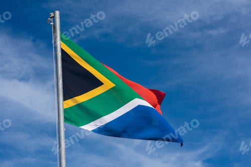 Preview: South African flag against clean blue sky