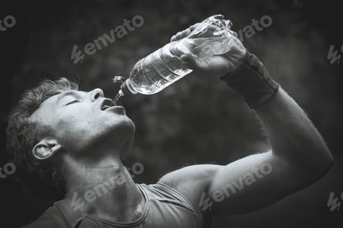 Preview: Man Drinking Water After Running Banks. Black And White Photography