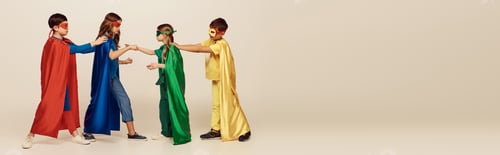 Preview: side view of multicultural kids in colorful superhero costumes with masks and cloaks fighting