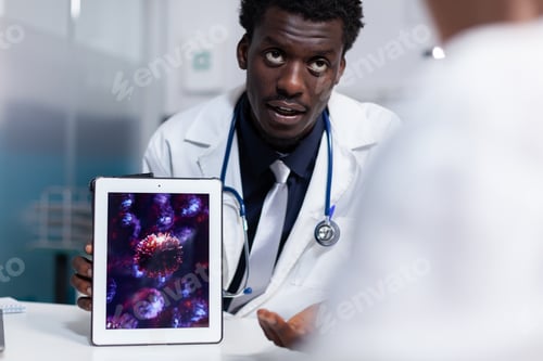 Preview: Doctor of african american ethnicity holding digital tablet