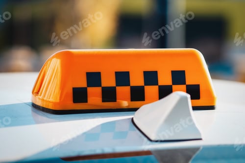 Preview: Checkered taxi sign on top of the car closeup