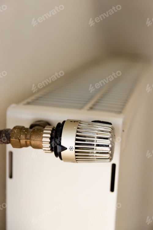 Preview: Vertical shot of the thermostat of heating radiator in an apartment