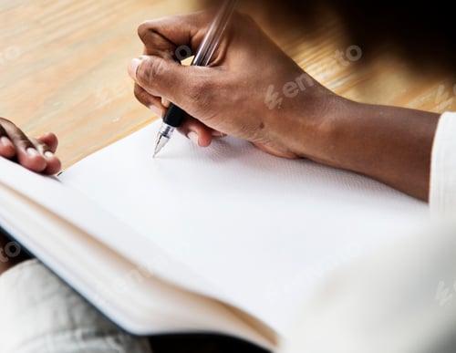 Preview: Woman writining in a notebook