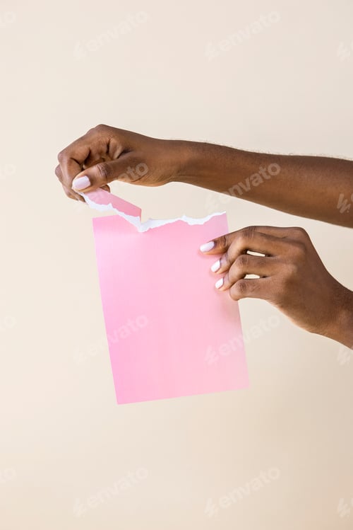 Preview: Black woman tearing pink paper