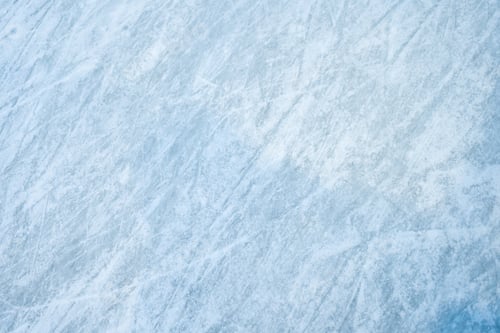Preview: Icy background on rink with visible traces of skating