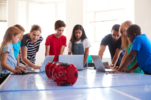 Preview: Group Of Students In After School Computer Coding Class Learning To Program Robot Vehicle