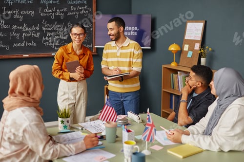 Preview: Multiethnic Young Adults Studying English Language Together in Classroom