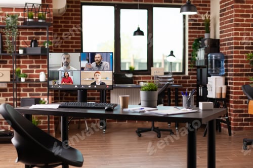 Preview: Video call communication with colleagues on computer in empty business office