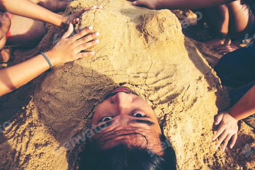Preview: Man buried in the sand at the beach. concept happiness, vacation, no problem, everything is fine.